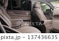 Interior of a passenger car with beige leather seats.  137436635