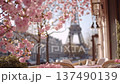 Coffee and pastries on a table with flowers and a view of the Eiffel Tower in Paris during springtime in the morning 137490139