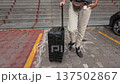 Anonymous Traveler: Man with Suitcase in Motion 137502867