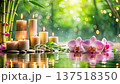 The aesthetics of spa care with warm candlelight and tropical flowers 137518350