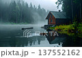 Cozy wooden cabin by a misty lake at dawn with a beaver swimming in the calm water. Scenic wilderness landscape, serene nature background. 137552162