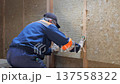 Insulation of a frame house with mineral wool. Cutting, fitting, laying insulation. Construction works. 137558322