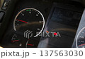 Dashboard of heavy vehicle displaying critical warning for low air pressure and active stop signal, indicating urgent maintenance need 137563030