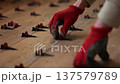 Man fixing Tile Leveling System Components. Man tiling a floor. 4K 137579789