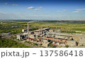 Approaching factory chimneys, contributing to air pollution and harming the atmosphere 137586418