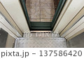 Vintage elevator doors opening revealing a tiled floor 137586420
