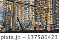 Urban landscape with power lines and residential building 137586423
