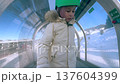 Little Child Riding Covered Magic Carpet Lift On Skis At Ski Resort Close Up, French Alps 137604399