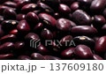 A close-up of a large amount of red kidney beans in a clear storage jar. Macro shot of the beans with a shallow depth of field. 137609180