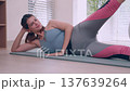 Young caucasian woman doing fitness workout on mat at home. 137639264