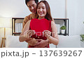 Portrait happy asian couple holding heart card celebrating Valentine's Day or anniversary together. 137639267