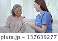Asian woman nurse explaining medicine instruction to senior patient. 137639277