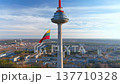 Giant tricolor Lithuanian flag waving on Vilnius television tower. Lithuania. 137710328