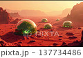 Explore a Martian landscape featuring glowing green domes set against a backdrop of red rocks at sunset. Discover the allure of possible extraterrestrial life. 137734486