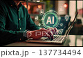 A person engages with an advanced laptop displaying artificial intelligence graphics in a bright and trendy office setting during the day. 137734494
