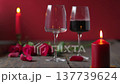 Red Wine Being Poured into Glass on Wooden Table 137739624