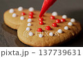 Heart Shaped Gingerbread Cookies with Red Icing Close Up 137739631