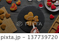 decorating heart shaped gingerbread cookies 137739720