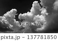 Time-lapse of multiple white clouds moving across a black background 137781850