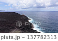Drone flying along volcanic lava coast toward stranded tanker, Chemin des Laves, Reunion Island 137782313