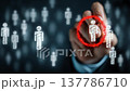 Business professional highlights a specific silhouette from a digital crowd using a glowing red circle, showcasing targeted selection in a contemporary setting 137786710