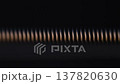 Macro vibrating guitar string with glowing reflections on dark background 137820630
