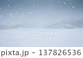 Beautiful winter background of snow and blurred forest in background, Gently falling snow flakes against blue sky. Wide panorama format. 137826536