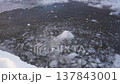 Ice Fragment Dropping into Water Through Broken Ice 137843001