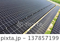 Aerial tracking shot with rotation over solar panel rows 137857199