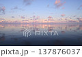 A scene from Palau: a calm, mirror-like sea surface and a dawn sky. A scene from Palau: a calm, mirror-like sea surface and a dawn sky. 137876037