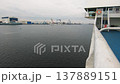 View from a ship deck on an industrial port with cranes, shipyards and warehouses 137889151