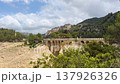 A reservoir with azure water in the mountains of Spain, a trail near Montanejos, Castellon. A dam covers the river for safety during heavy rains. A popular place for active recreation. The Arenos 137926326