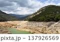 A reservoir with azure water in the mountains of Spain, a trail near Montanejos, Castellon. A dam covers the river for safety during heavy rains. A popular place for active recreation. The Arenos 137926569