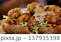 Delicious Crispy Shrimp Po Boy Sandwich Drenched in Creamy Sauce 137935398