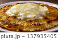 Delicious Golden Pancake Topped With Creamy Butter and Syrup 137935405
