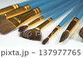 Horse hair brushes in various sizes and shapes. Painting brushes with natural pony bristle. Brush set of various shapes for painting. Round and flat brushes for artistic painting lie on white canvas 137977765