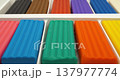 Colorful blocks of modeling clay for art projects. Colorful pieces of plasticine in a box. Soft modeling clay blocks for creative fun. Fun clay blocks for skillful modeling 137977774