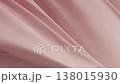 Soft red pink fabric flowing gracefully in air creating elegant minimal texture background with gentle folds smooth surface and delicate motion symbolizing calmness beauty, and modern visual harmony 138015930