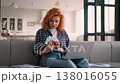 Professional Caucasian woman designer talking on laptop online video call showing color samples indoor at home creative female helping client modern fashion interior girl presenting design on computer 138016055
