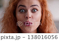 Shocked amazed Caucasian woman surprised happy female open mouth wow reaction face indoors stunned excited girl lady emotional amazement good news win success victory achievement unbelievable close up 138016056