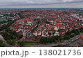 Aerial drone view of Nuremberg old town in Germany with historic buildings, red roofs and medieval architecture. Scenic European cityscape under cloudy sky.  138021736