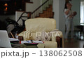 Working mother multitasking on the phone while holding her newborn baby at home 138062508