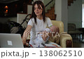 Tired mother working on laptop while holding sleeping baby 138062510