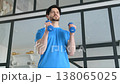Active sporty fitness man practicing dumbbell hammer curl workout, building strength in arm muscles and boosting athletic performance during sports training at home.. 138065025