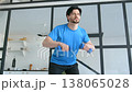 Portrait of active motivated good looking sporty fit man in sportswear practicing weight training , doing bent over dumbbell rows workout while exercising in domestic room. 138065028