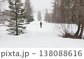 walking under a snowing winter season in dolomites mountains  138088616