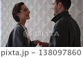 Couple shares a joyful moment in a modern indoor setting 138097860
