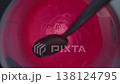 Stirring Pink Drink In A Glass With A Spoon And Tapping It Against The Glass Walls, Slow Motion Macro. 138124795