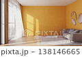 Modern living room with yellow walls and sunlight streaming through window 138146665