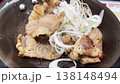Grilled pork marinated in Japanese sauce on a pan with onions 138148494